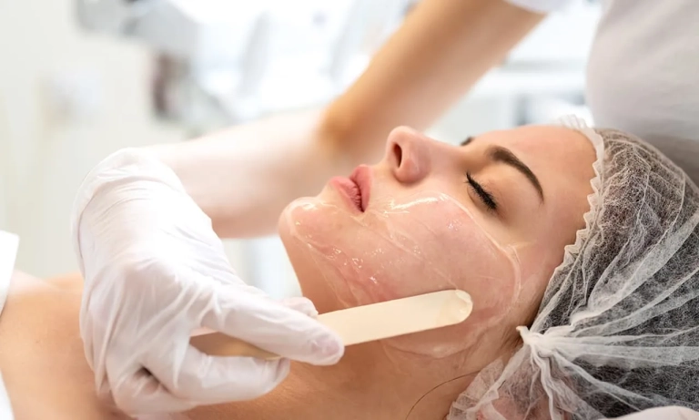 Photo of a woman getting a facial peel bar