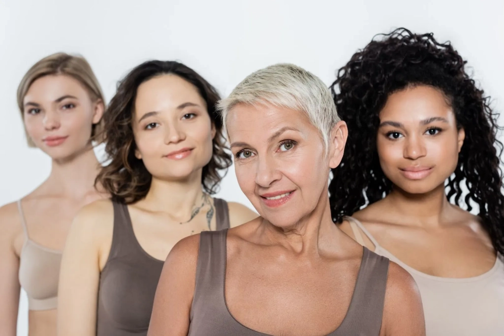 Group of beautiful multigenerational women looking into the camera