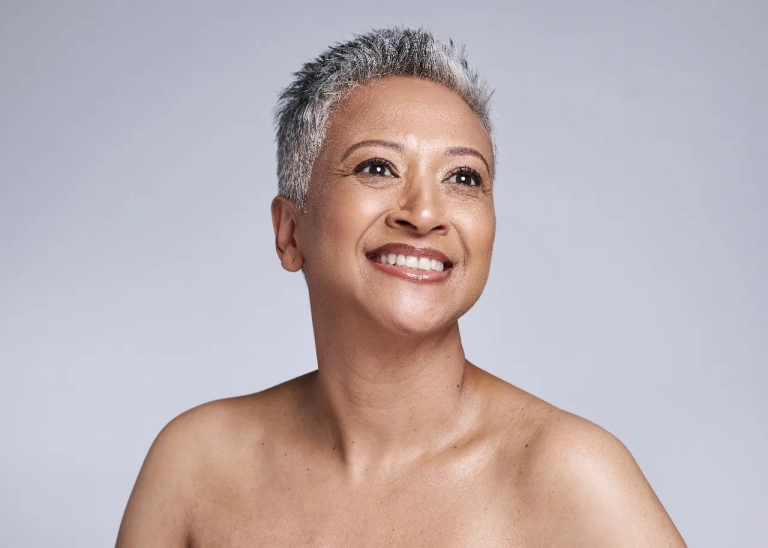 Photo of a woman looking off the the side for The Hughes Center